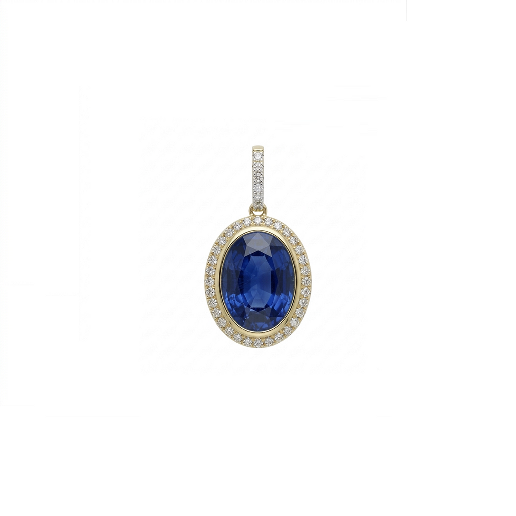An oval pendant featuring a deep blue sapphire center stone surrounded by a halo of small clear stones, set in yellow gold with a diamond-accented bail, shown on a plain white background.