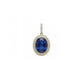 An oval pendant featuring a deep blue sapphire center stone surrounded by a halo of small clear stones, set in yellow gold with a diamond-accented bail, shown on a plain white background.