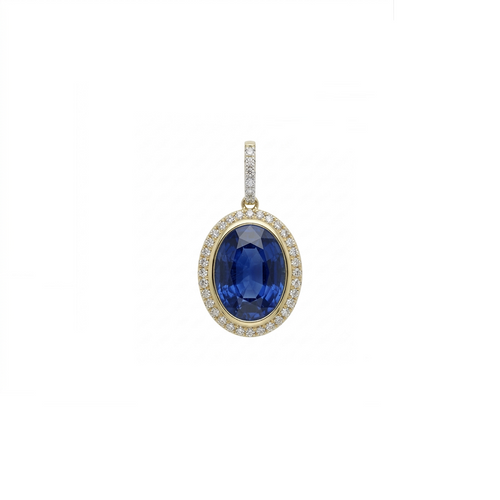 An oval pendant featuring a deep blue sapphire center stone surrounded by a halo of small clear stones, set in yellow gold with a diamond-accented bail, shown on a plain white background.