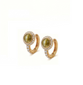 A pair of gold huggie hoop earrings featuring oval green cat's eye stones surrounded by a halo of small clear pavé stones, set against a plain white background.