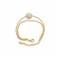 A delicate yellow gold chain bracelet featuring a round bezel-set clear gemstone at the center, displayed on a clean white background.
